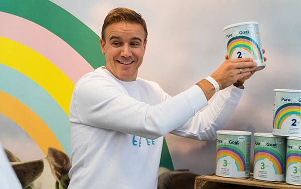 Pure Goat Company founder with products
